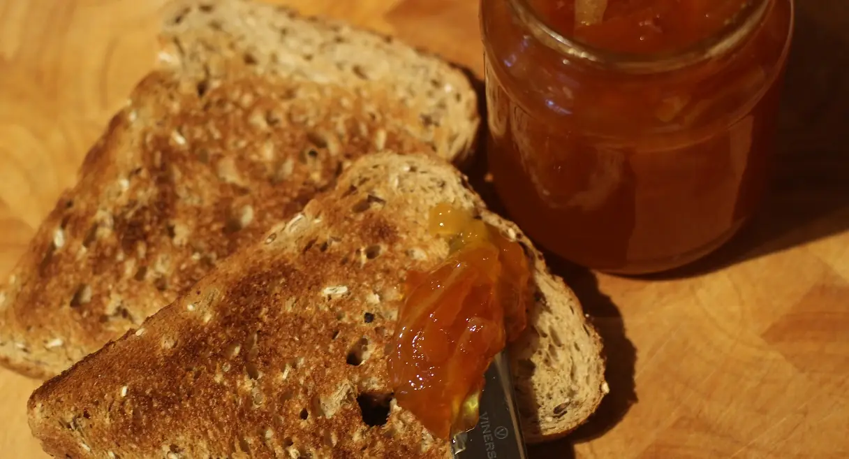 Marmalade on toast beside the jar